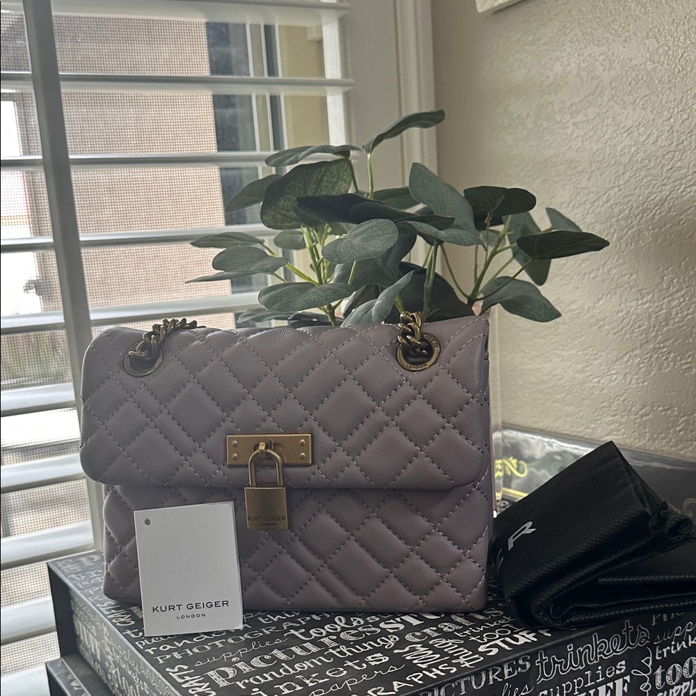 NWT Kurt Geiger mini Brixton Lock Bag in the color lilic.
